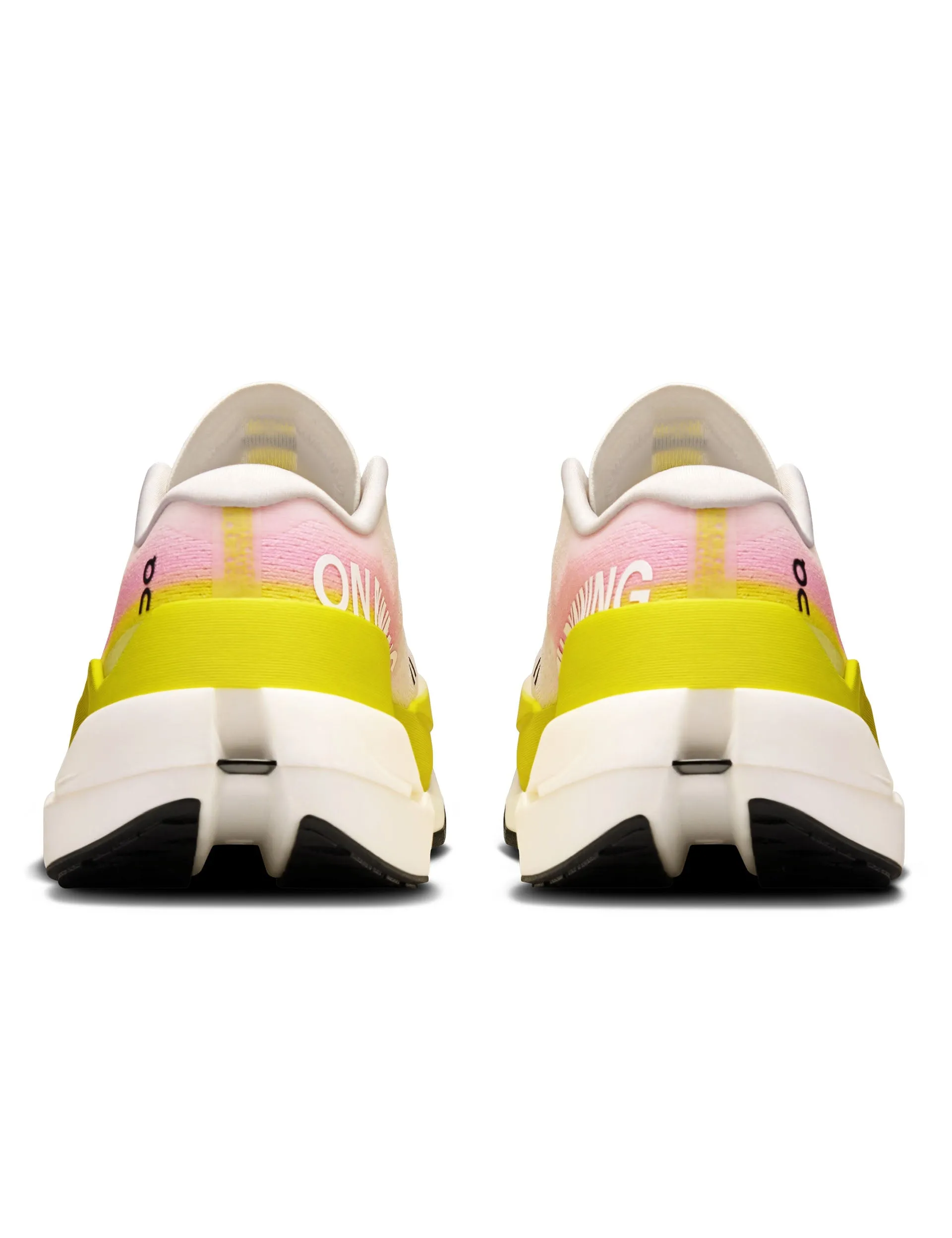 Cloudboom Max - Lime/Raspberry solo running running in an estuary area shoes