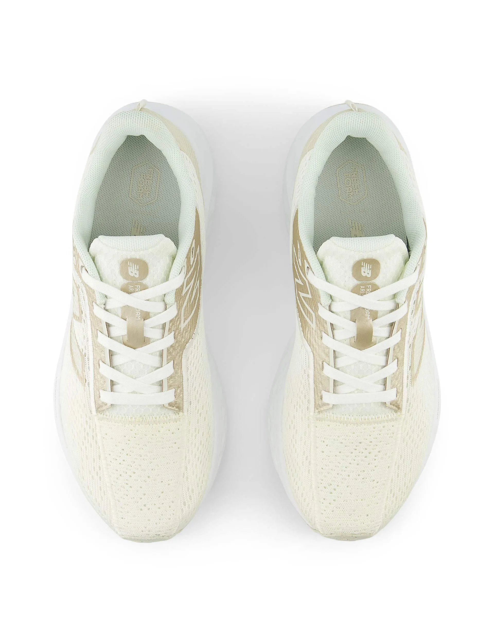 Fresh Foam Arishi v4 - Sea Salt running on a rubber track shoes individual sport